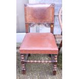 A late 19th century carved mahogany side chair, upholstered in a brown leather, on turned and