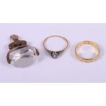 An 18ct gold dress ring set brilliants, a similar 18ct gold single stone ring, 4.6g gross, and a