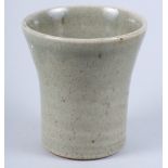A St Ives studio pottery flared beaker, in a celadon glaze, 3 3/4" high