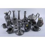 Two pairs of pewter candlesticks, a pewter tea caddy, a pewter teapot and other pewter