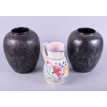 A pair of Poole pottery black lustre decorated baluster vases, 9" high, and a 1950s floral decorated
