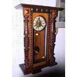 A mid 20th century oak cased American wall clock