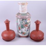 A pair of Japanese terracotta vases, two terracotta plates and a Canton enamelled vase, 18" high (