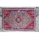 A Qashqai rug with grey central ground and all over bird and animal design, 66" x 43" approx