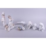 Three Lladro polar bears, a goose, two lambs and a duck with ducklings