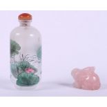 A Chinese reverse painted snuff bottle with lily and duck decoration, 3 1/2" high, and a rose quartz