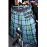 A blue and green hunting tartan kilt, waist approx 34", and a sealskin sporran