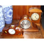 An Edwardian mahogany and line inlaid mounted clock, 6" high, an oak cased mounted clock with