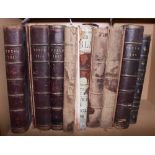 Seven late 19th century leather bound editions of Punch and one other leather bound book