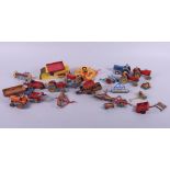 A quantity of die-cast Dinky Toys farming vehicles and accessories, including Massey Harris