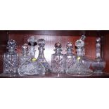 Nine cut glass decanters and stoppers of various designs