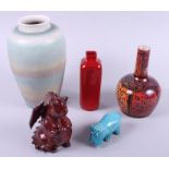 A Lancastrian green glazed vase, a red Royal Doulton vase, a model of a dragon and other items