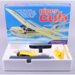 A Hobbico "Classic Biplane" free flight electric airplane, boxed, and a radio controlled Piper Cub
