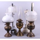 Three oil lamps and shades, and two pressure lamps and shades