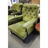 A late Victorian ebonised and gilt frame open armchair, button upholstered in a green velvet, on