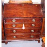 A Georgian mahogany string inlaid bureau with four graduated drawers, on bracket supports, 37"