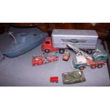 A selection of tin-plate toys, including a fire engine, a Grey Van Lines lorry, an M-35 tank and a