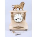 A 19th century alabaster and gilt metal mantel clock with lion surmount, 13 1/2" high