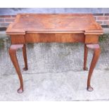 A Georgian figured walnut fold-over top card table with single gate action, on cabriole supports and