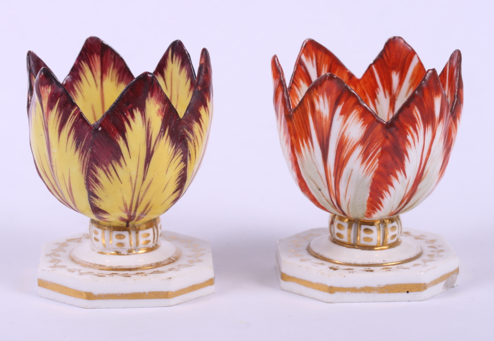 Two 18th century Derby "Tulip" pattern egg cups, on octagonal bases (restorations 2 1/4" high