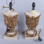 A pair of carved giltwood lamps with acanthus leaf decoration, on square bases, 13" high