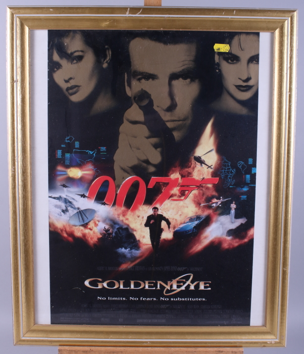 A James Bond "Golden Eye" poster, in gilt frame, and a "Tom and Jerry" print