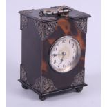 An Edwardian tortoiseshell and silver mounted carriage clock with striking movement, 5" high