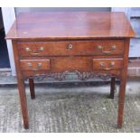 An 18th century Pembrokeshire oak lowboy, fitted one long and two shallow drawers over pierced