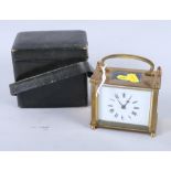 A brass cased carriage clock with white enamel dial, 3 1/2" high x 4" wide, in leather travel case