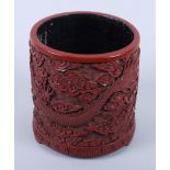 A Chinese cinnabar lacquer brush pot with dragon decoration and seal mark to base, 5 1/4" high