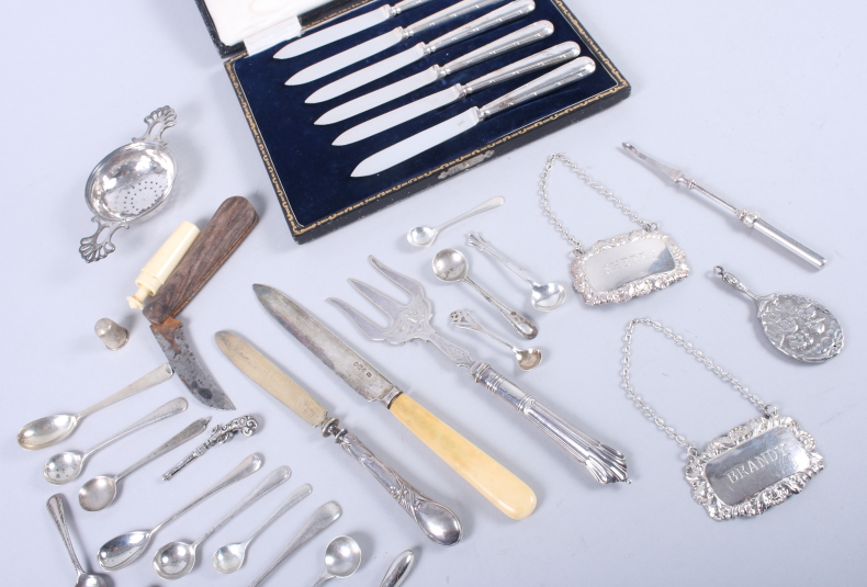 A selection of silver items, including condiment spoons, a tea strainer, two decanter labels, a - Image 3 of 4