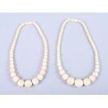 Two plain ivory graduated bead necklaces