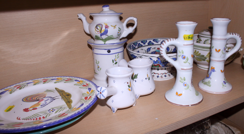 A Quimper plate, decorated a cockerel, two Quimper pots and covers, two matching bowls, one with two