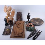 A carved figure of a dancer, a brush pot, a carved wooden plaque of a man drinking, a bust, masks