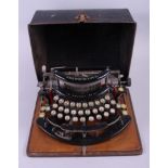 An early 20th century Imperial Model B portable typewriter, in original tin case, numbered 23715