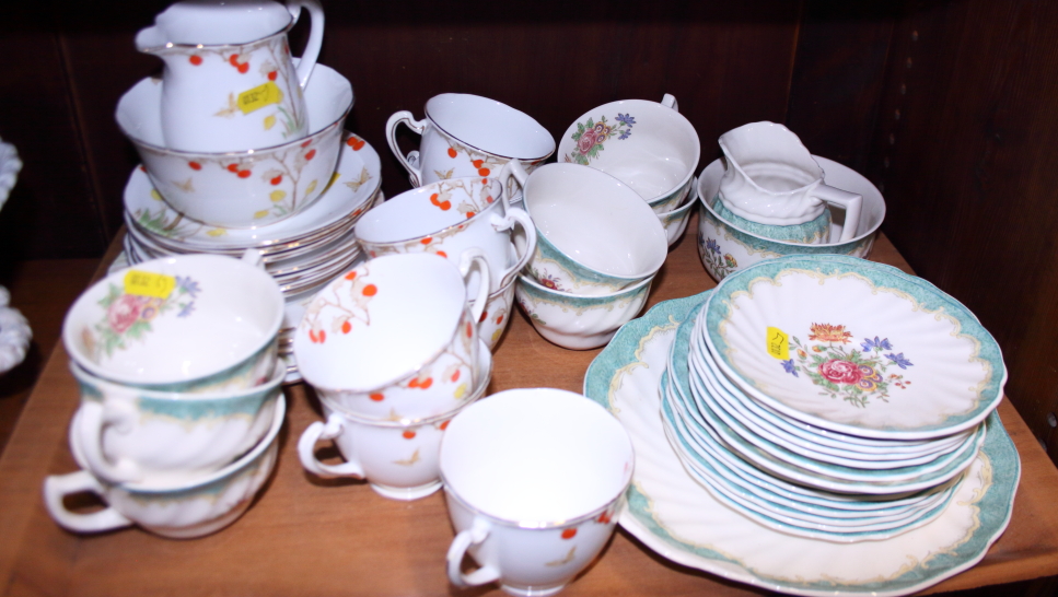 A Doulton "Kingswood" pattern part teaset and a Lawleys bone china "Orange Tree" pattern teaset