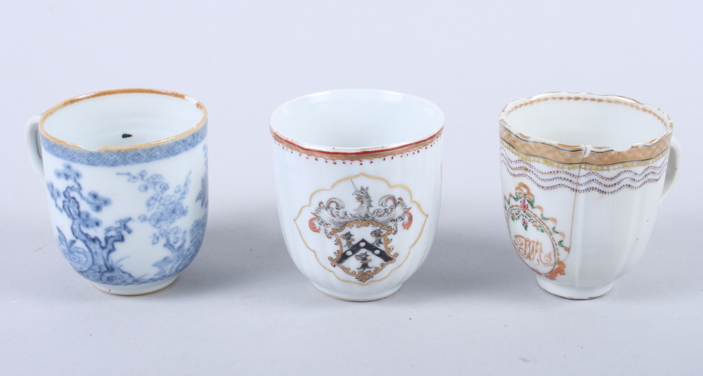 Three 18th century Chinese armorial cups, various crests (rim chips, repairs and rubbed gilding)