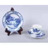 A late 18th century Chinese blue and white cup and saucer with buffalo and landscape decoration (