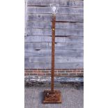 A figured walnut square-section standard lamp