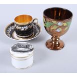A 19th century French porcelain cabinet cup and saucer with hazel nut decoration (rim chip to