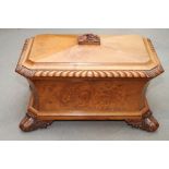 A Regency carved pollard oak wine cellarette with zinc lined interior, on oak leaf and acorn