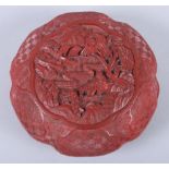 An antique Chinese cinnabar lacquer box with landscape and figure decoration, 4 1/2" wide (damages)
