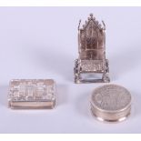 A modern silver castle top pill box, decorated with view of Windsor Castle, a modern silver box made