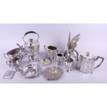 A silver plated kettle, on stand, a collection of plated tea utensils, a plated model of a cockerel,