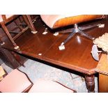 A late 19th century walnut extending dining table with extra leaf, on turned supports, top 42" x 70"