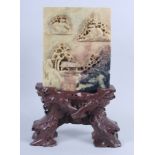 A Chinese carved hardstone table screen, on stand, 12 1/2" high, a Chinese soapstone recumbent Dog