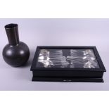 A suite of Viners silver plated cutlery, in black canteen, and a modern bronze vase, 13" high