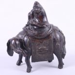 A Chinese bronze censer, formed as a Buddha riding an elephant, 6 1/2" high