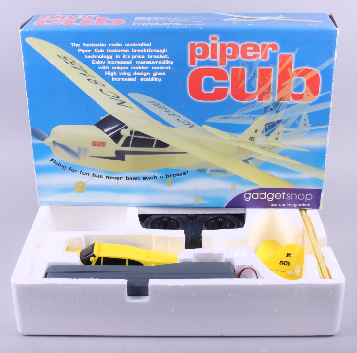 A Hobbico "Classic Biplane" free flight electric airplane, boxed, and a radio controlled Piper Cub