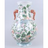 A modern Chinese porcelain vase decorated peaches and elephant handles, 15" high